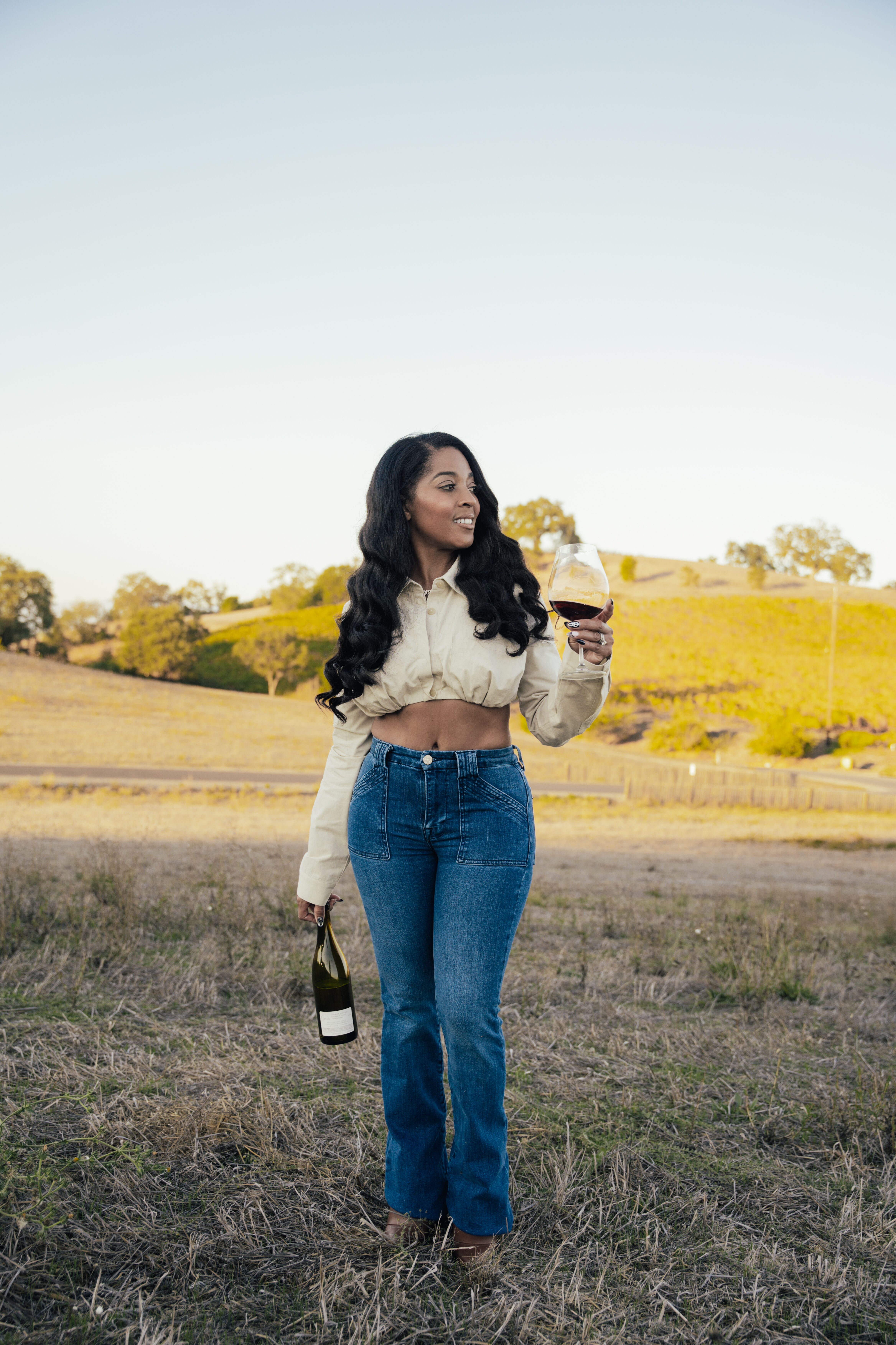 Josh Flagg sitting with wine in ice bucket on table in front of him.